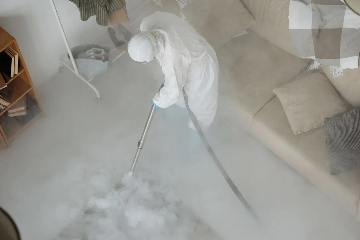 Biohazard cleanup technician in protective equipment, St. Bernard, OH